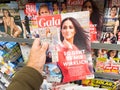 POV male hand buying latest newspaper magazine Gala magazine with Meghan Markle