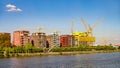 Frankfurt, Germany Ã¢â¬â September 3, 2011: Cityscape at the bank of Main river with modern living houses construction sites in