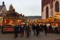 FRANKFURT AM MAIN, GERMANY - December 2018: people walk around Frankfurt Square during the Christmas market, buy sweets, ride on