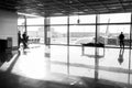 Frankfurt am Main, Germany - October 11, 2015: people wait for for flight in airport at big window glass. Tourist Royalty Free Stock Photo