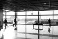 Tourist passengers with suitcase, luggage in lounge hall. People wait for for flight in airport at big window glass Royalty Free Stock Photo