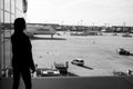 Frankfurt am Main, Germany - October 11, 2015: woman in airport. Girl silhouette look at planes on airdrome ground on Royalty Free Stock Photo