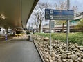 Frankfurt am Main, Germany - 07.11.2023: Terminal signage and sightseeing tour. A yellow bus Royalty Free Stock Photo