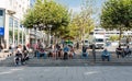 Frankfurt am Main, Hesse Germany - Tourists and locals sitting at the stairs, eating ice cream and drinking soft