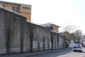 Frankfurt - March 2022: high concrete fence, barbed wire fence on top, building for execution of punishments for criminals, police