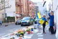 Frankfurt - March 2022: people support Ukraine, flowers lie on ground, mourning candles burning for dead, an anti-war rally near