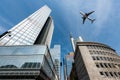 Frankfurt skyscrapers buildings and a plane flying overhead in m Royalty Free Stock Photo