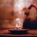 Frankincense burning on a hot coal. Aromatic frankincense.