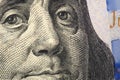 Franklin`s face in close-up on a 100 hundred dollar bill fragment