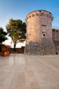 Frankopan fortress tower marble pavement and little wooden shop Royalty Free Stock Photo