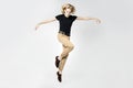a frantic and expressive jump, hair scatter in different directions. Portrait of a jumping man