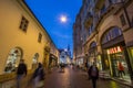 Frantiskanske ulice street in the city center of Brno, surrounded by boutiques, at night, with Kostel svate mari magdaleny church