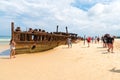 People at the Maheno shipwreck on 75 mile beach, one of the most popular landmarks on Fraser Island, Fraser Coast, Queensland, Aus Royalty Free Stock Photo
