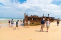 People at the Maheno shipwreck on 75 mile beach, one of the most popular landmarks on Fraser Island, Fraser Coast, Queensland, Aus Royalty Free Stock Photo