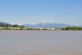 Fraser river with scenic river bank and snow mountains Royalty Free Stock Photo