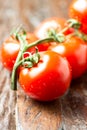 Frash farm tomatoes on wooden table