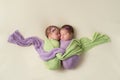 Fraternal Twin Newborn Girls in Swaddles