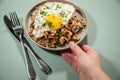 Woman eating German Friesland north sea shrimps with whole grain bread, fried egg and parsley Royalty Free Stock Photo