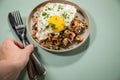 Woman eating German Friesland north sea shrimps with whole grain bread, fried egg and parsley Royalty Free Stock Photo