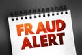 Fraud Alert text on notepad, concept background Royalty Free Stock Photo