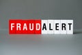 Fraud alert - word concept on building blocks, text Royalty Free Stock Photo