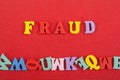 FRAUD word on red background composed from colorful abc alphabet block wooden letters, copy space for ad text. Learning english Royalty Free Stock Photo