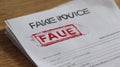 Fraudulent Invoice on Desk With Red Stamp Clearly Indicating Illegitimacy and Space for Additional Notes Royalty Free Stock Photo