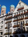 Frauenkirche and facade of the Hirmer house in the Center of Munich