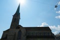 FrauenmÃÂ¼nster Church, in Zurich, in lateral view, its silhouette against clear blue sky and shining sun in upward perspective