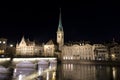 Fraumunster church at night reflected in the river