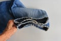 Frayed legs of a pair of faded jeans Royalty Free Stock Photo
