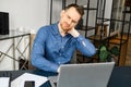 Frazzle guy using laptop for remote working, a guy tired and burnout Royalty Free Stock Photo