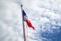 Frazzled flag of France waving in the wind