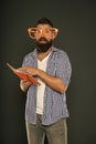 Freak and geek. Bearded man in party glasses reading book. Study nerd holding lesson book. University male student with