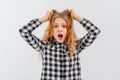 Freaked out shocked teen girl screaming displeased panicking hold hands on hair, frowning looking terrible mess bad situation Royalty Free Stock Photo