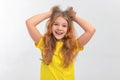 Freaked out shocked teen girl screaming displeased panicking hold hands on hair, frowning looking terrible mess bad situation Royalty Free Stock Photo