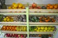 Organic fruit and vegetable shop arranged on wooden shelves