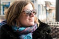 Freattyda, Athens - Greece - Happy thirty year old woman with sunglasses smiling on vacation sitting on a restaurant terrace