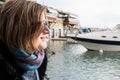 Freattyda, Athens - Greece - Happy thirty year old woman with sunglasses smiling on vacation with a yacht on the background