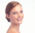 Freckled beauty. A studio portrait of a beautiful young redhead.