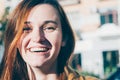 Freckled brunette young woman smiling