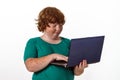 Freckled red-hair boy with laptop. Royalty Free Stock Photo