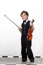 Freckled red-hair boy playing violin. Royalty Free Stock Photo