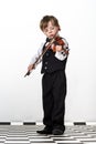 Freckled red-hair boy playing violin. Royalty Free Stock Photo