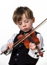 Freckled red-hair boy playing violin. Royalty Free Stock Photo