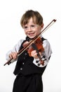 Freckled red-hair boy playing violin. Royalty Free Stock Photo