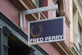 Fred Perry shop sign with golden laurel in New York