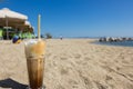 Freddo cappuccino on the beach. Royalty Free Stock Photo