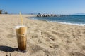 Freddo cappuccino on the beach. Royalty Free Stock Photo