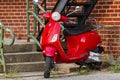 Isolated image of a red vintage Vespa GT200 scooter motorbike